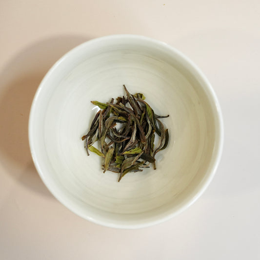 White Peony tea dry tea leaves close-up