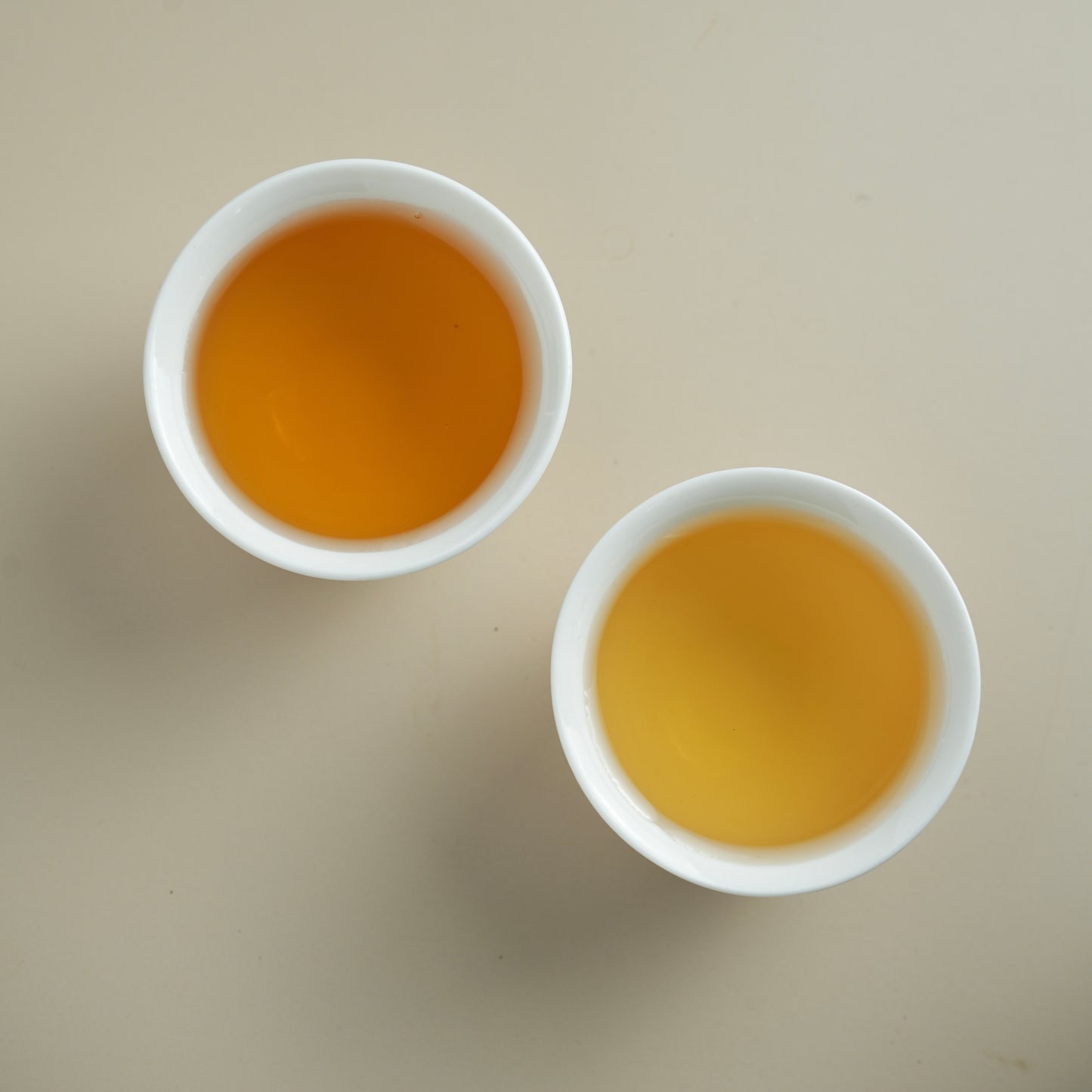 Floral and Aged Zhangpingshuixian brewed tea liquor in a white cup