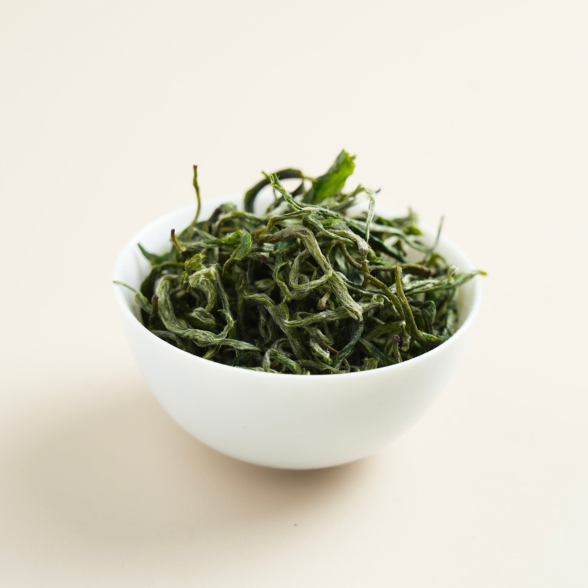 Classic Baojing Golden Green dry tea leaves close-up