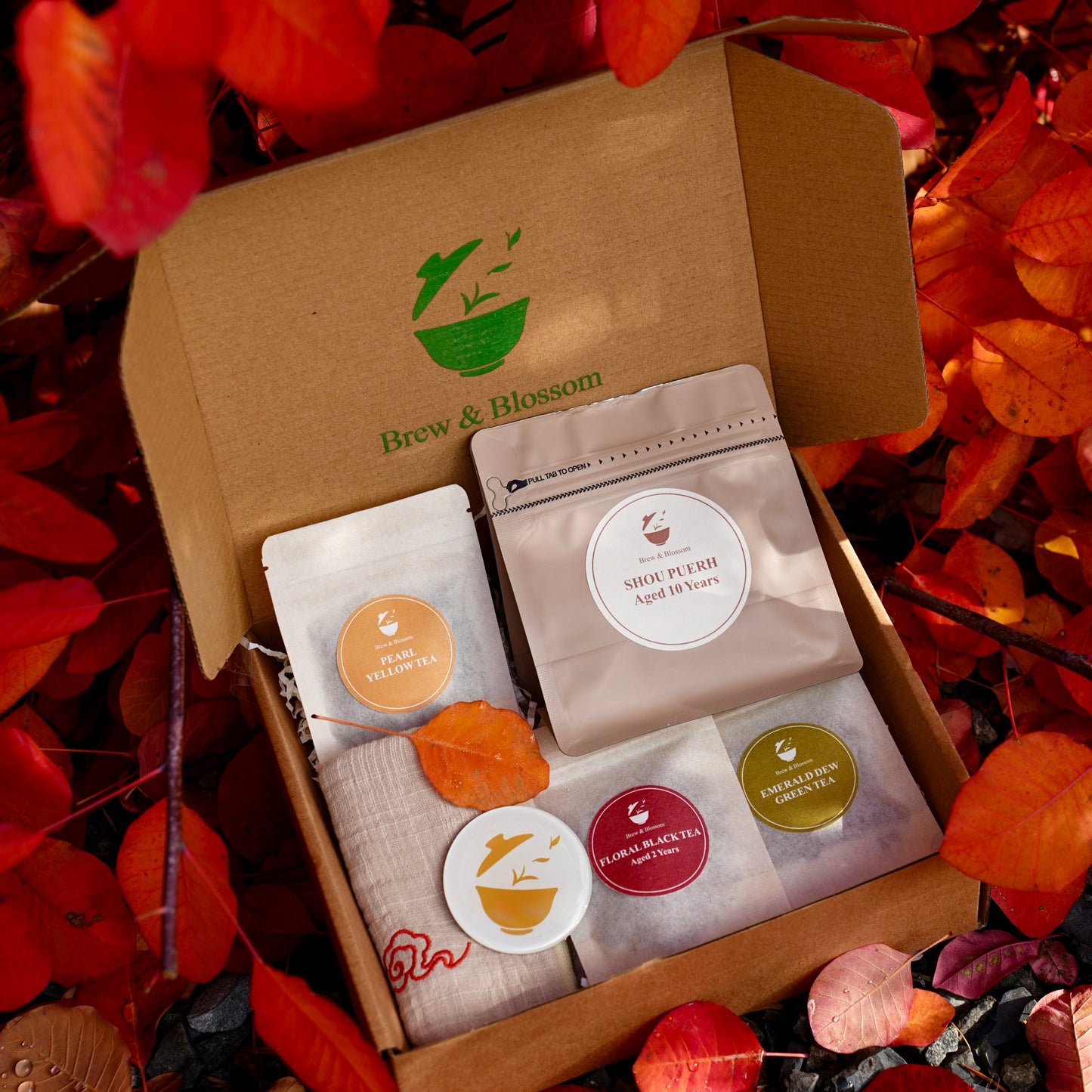 Brew & Blossom Winter Tea Gift Box with tea pouches, Shou Pu’erh Aged 10 Years, magnet, and tea towel